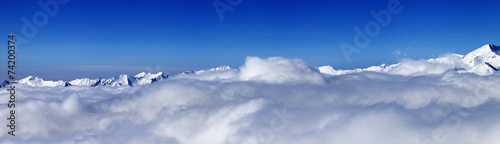 Panorama of mountains under clouds at nice day © BSANI