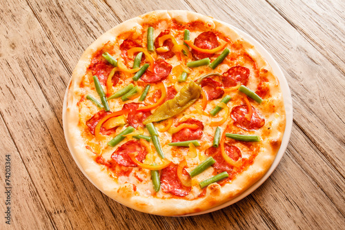 pizza on wooden background