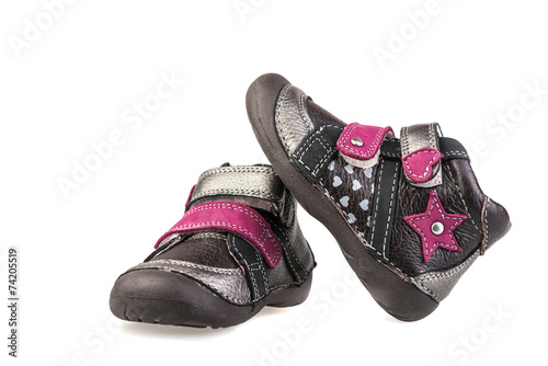 kid's shoes from the grey leather isolated on white background