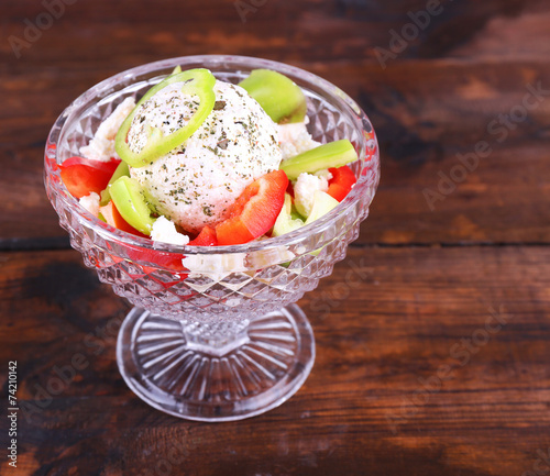 Cottage cheese with vegetables in piyala on wooden background photo