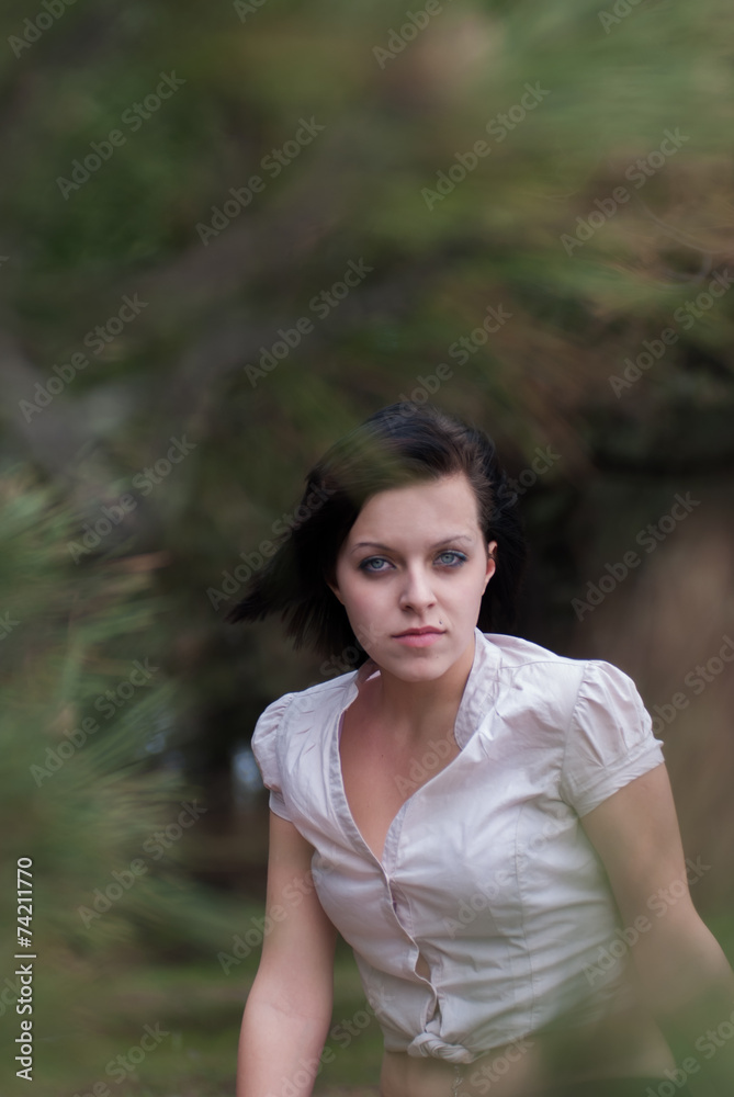 Young brunette beauty in nature looking at the camera Young brunette beauty in nature looking at the camera