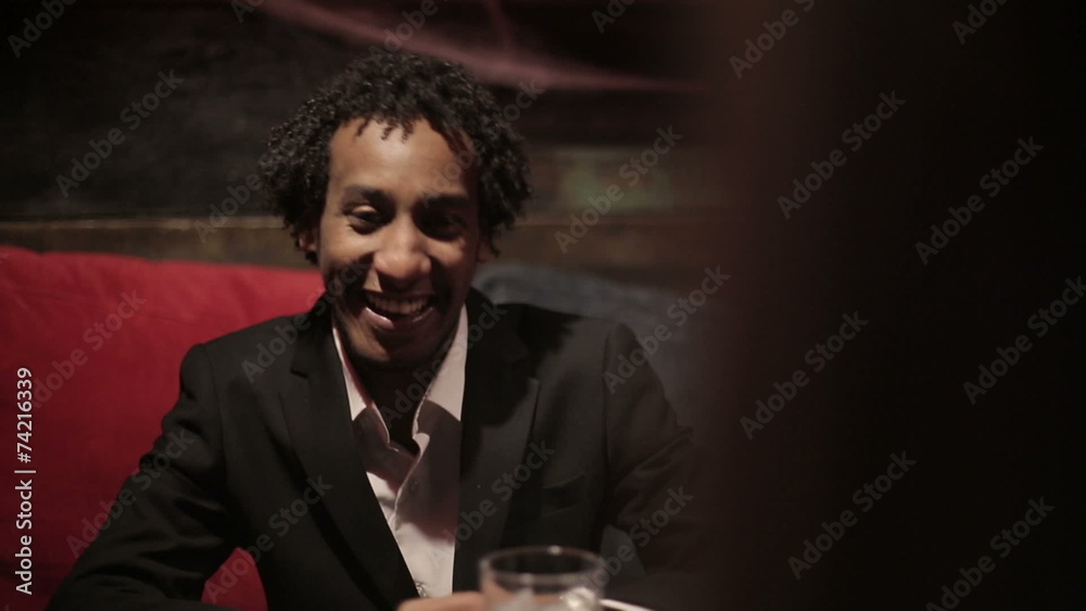 White woman and black man make dialogue at restaurant. White woman and black man make dialogue at restaurant.