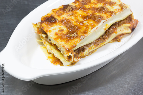 italian lasagna on white plate photo