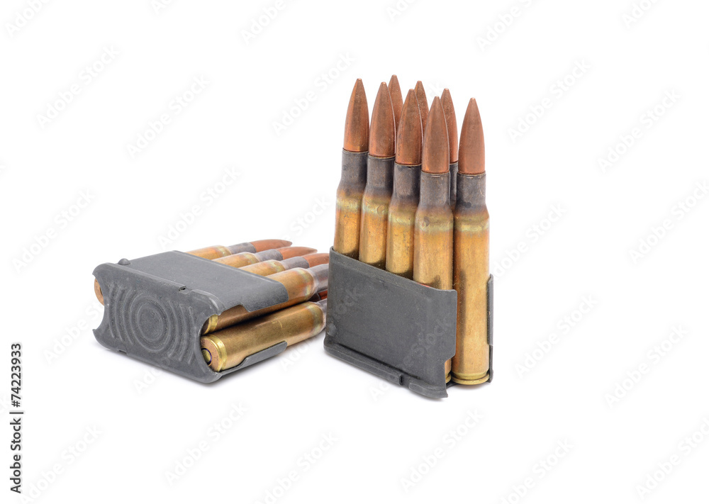 M1 Garand clips and ammunition on white background. Photos | Adobe Stock