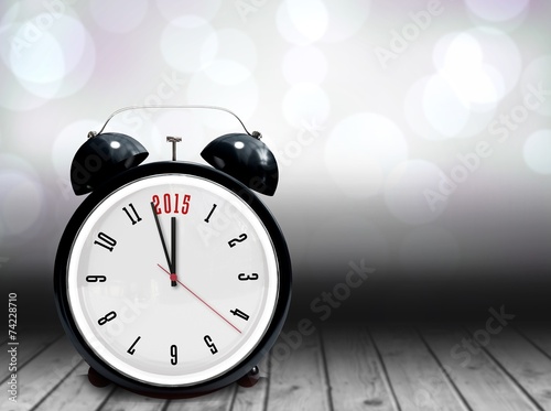 Composite image of 2015 in black alarm clock