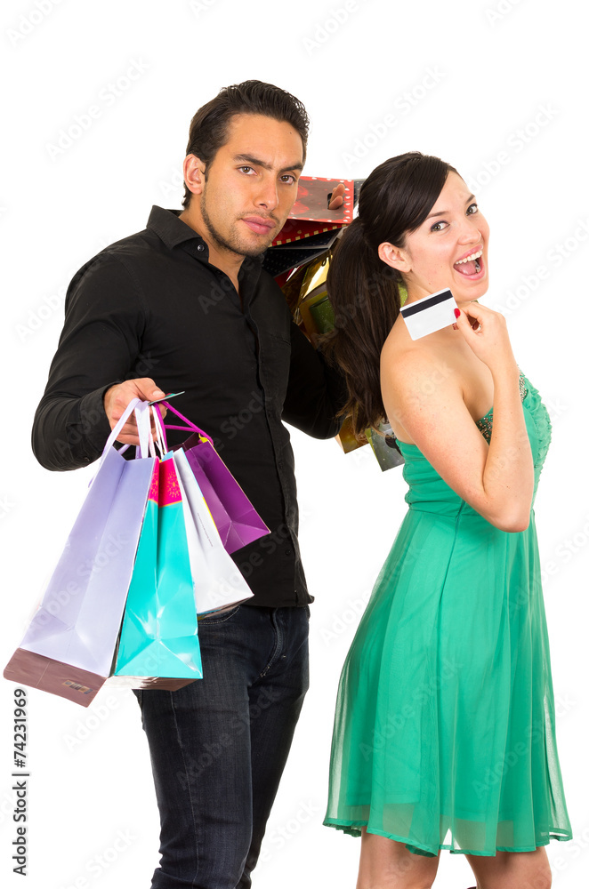 happy young woman holding credit card while unhappy annoyed happy young woman holding credit card while unhappy annoyed