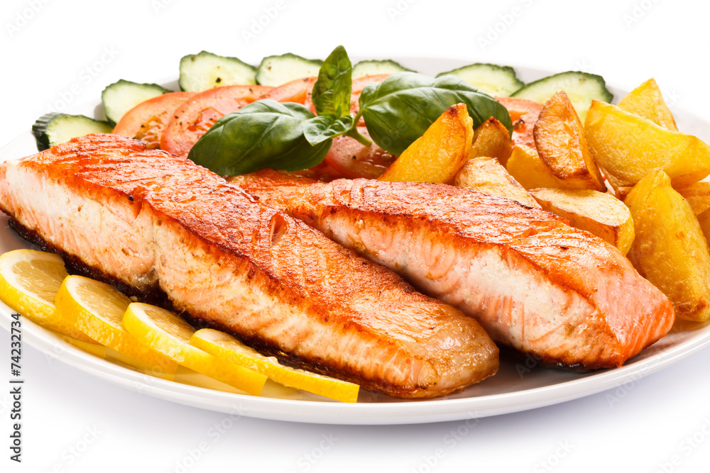 Grilled salmon and vegetables on white background Grilled salmon and vegetables on white background