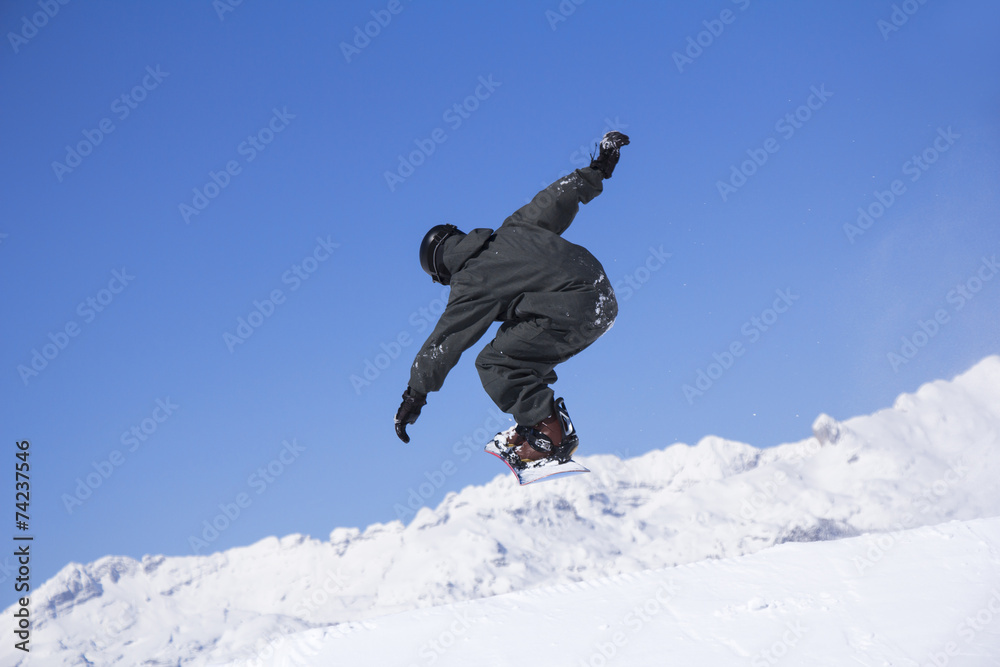 Extreme Snowboarder jumping