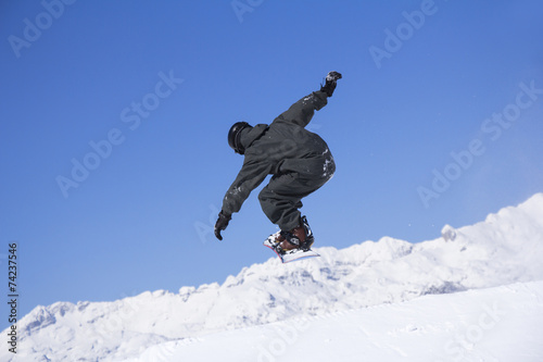 Extreme Snowboarder jumping