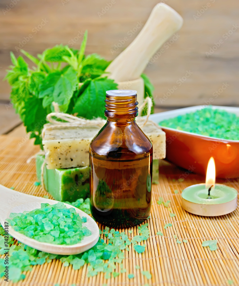 Oil and salt with nettles in mortar on board Oil and salt with nettles in mortar on board