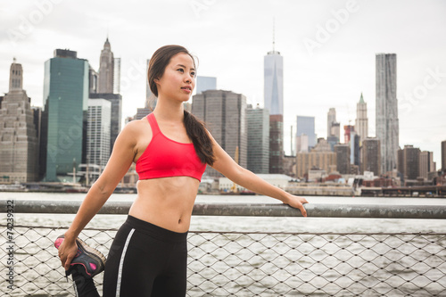 Asian Girl Doing Stretching Exercises in New York