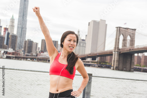 Asian Girl Doing Stretching Exercises in New York