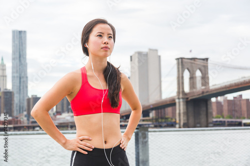 Asian Girl Resting After Fitness Exercises in New York