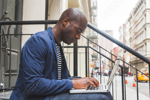 Photography Black Guy Using Notebook in New York