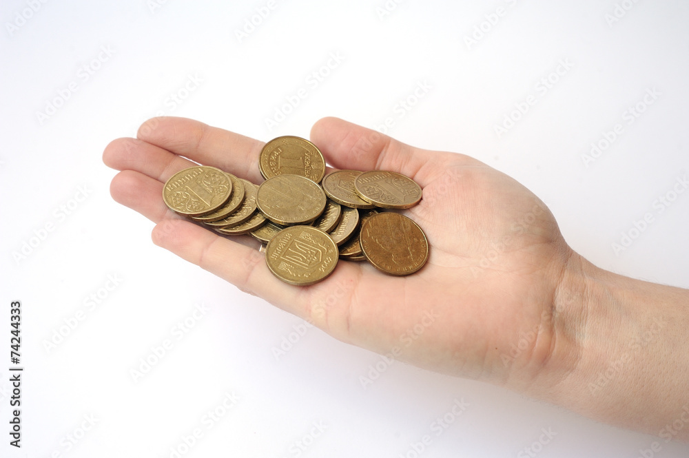 hand on a white background holding a handful of coins one hryvni hand on a white background holding a handful of coins one hryvni