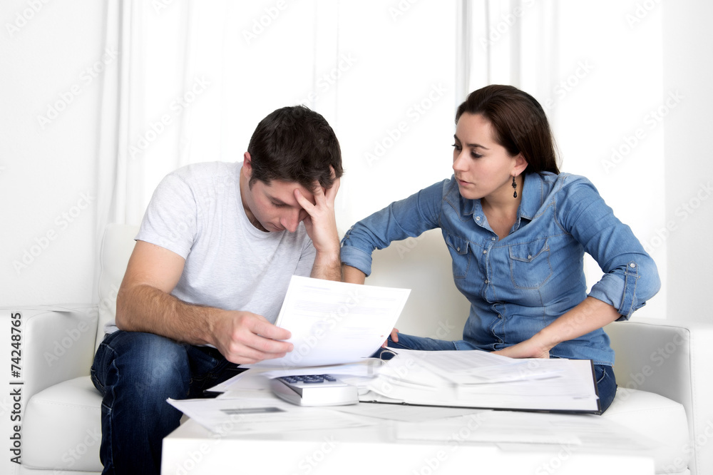 young couple worried home in stress accounting bank payments young couple worried home in stress accounting bank payments
