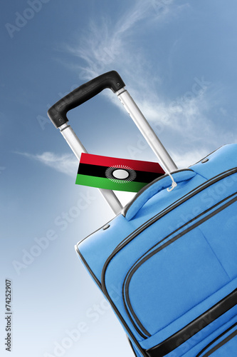 Destination Malawi. Blue suitcase with flag.