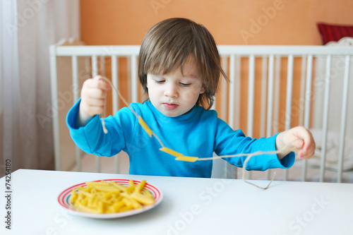 lovely 2 years boy made macaroni beads