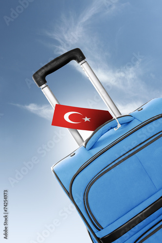 Destination Turkey. Blue suitcase with flag.
