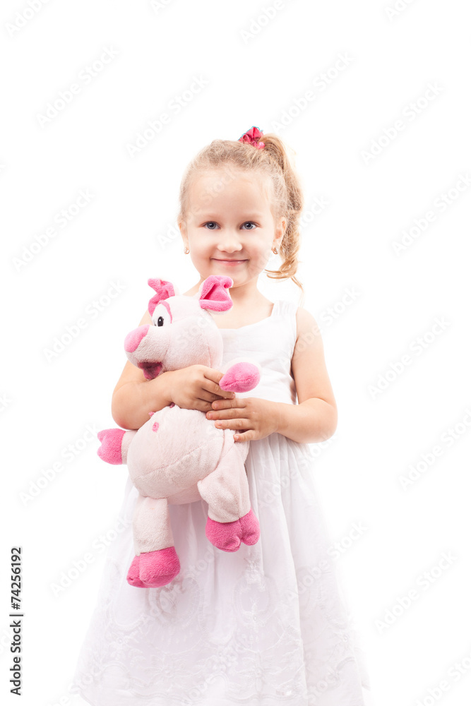 Cute little girl hold toy pig isolated