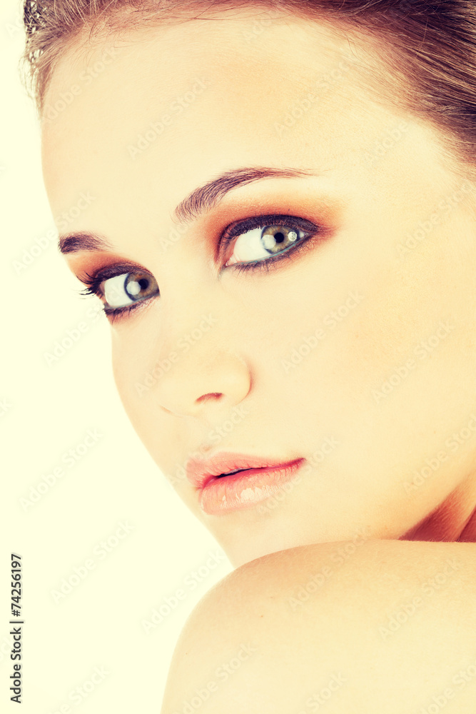 Fototapeta premium Attractive young woman's face. Closeup.