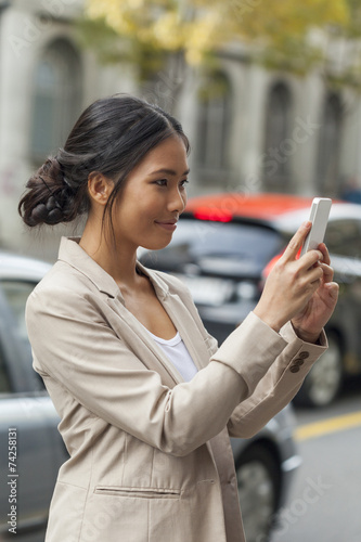Young woman looking at mobile phone