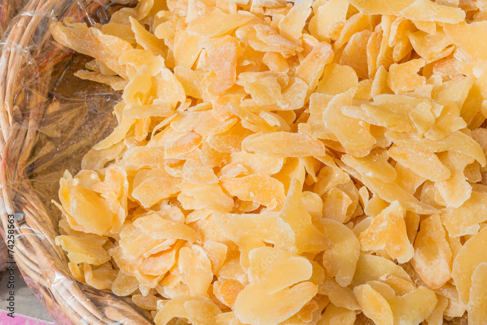 Candied Crystallized Ginger slices in wicker bowl Candied Crystallized Ginger slices in wicker bowl