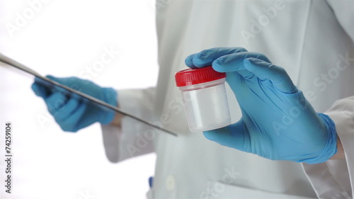 Doctor Gives Pee Sample Cup