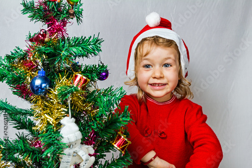 Happy small girl in Santa hat