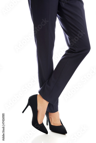 Close up on businesswoman slim legs in high heels