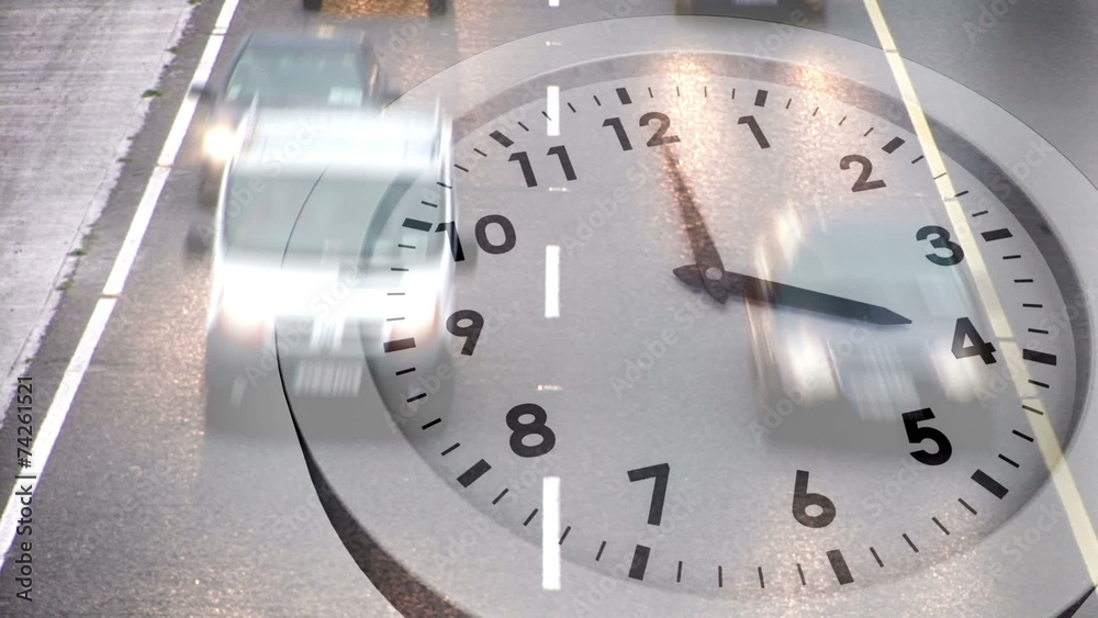 Clock ticking over traffic on road