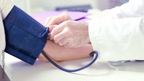 Doctor taking blood pressure
