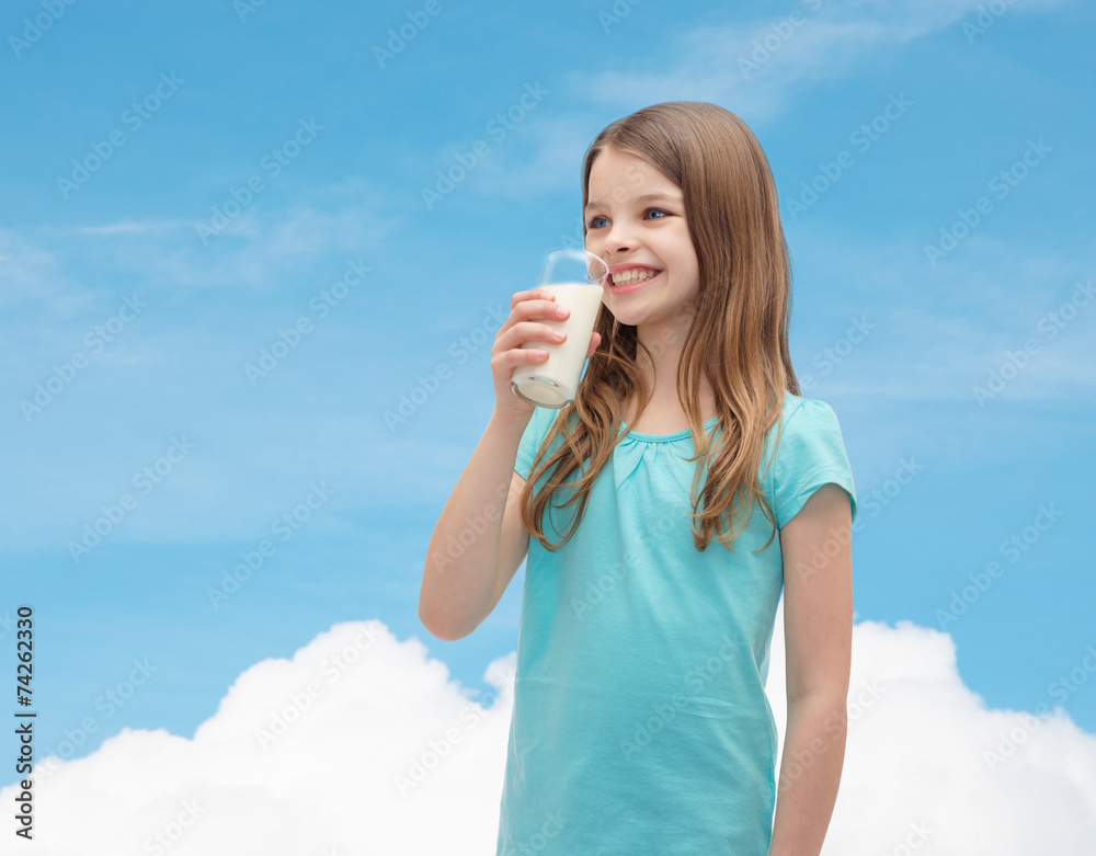 smiling little girl drinking milk out of glass smiling little girl drinking milk out of glass