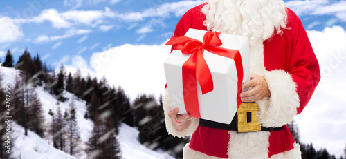 man in costume of santa claus with gift box