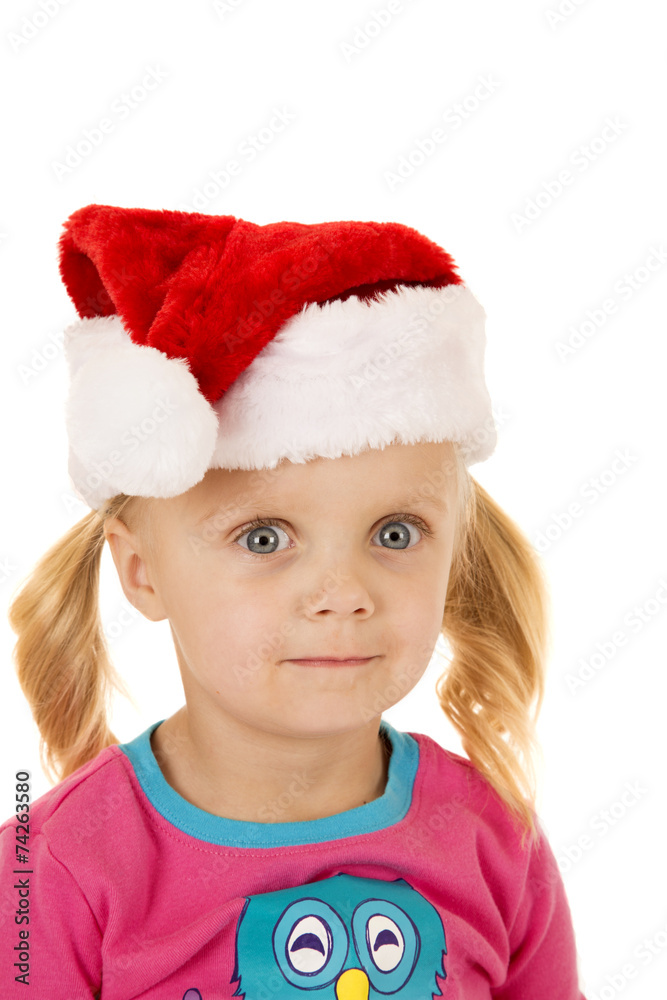 Wide eyed blond girl portriat wearing santa hat Wide eyed blond girl portriat wearing santa hat