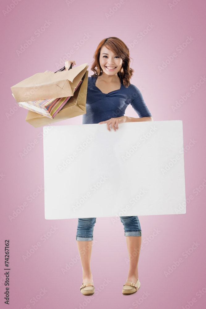 Shopping woman holding bags and blank board Shopping woman holding bags and blank board