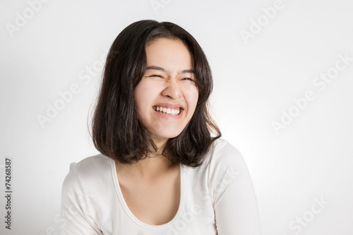 Young Asian woman with smiley face.
