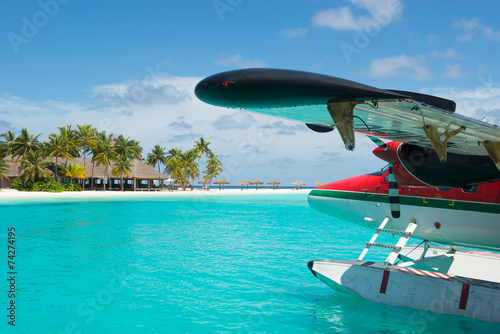 Sea plane, tropical beach resort photo