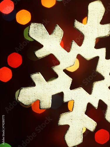 Christmas decoration in the form of a wooden snowflake