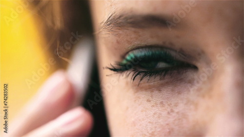 Woman talking on cellphone, closeup