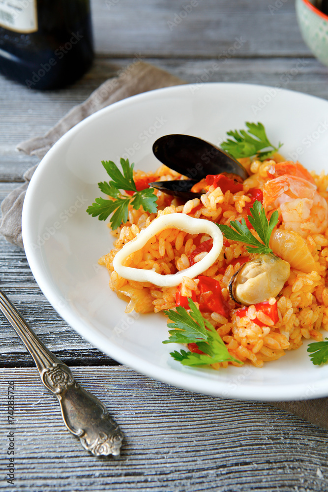 Risotto with meat mussels and rice on a bowl Risotto with meat mussels and rice on a bowl