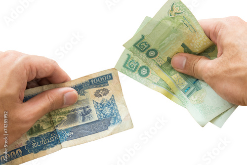 money exchange Laos Kip to Thai Baht, isolated
