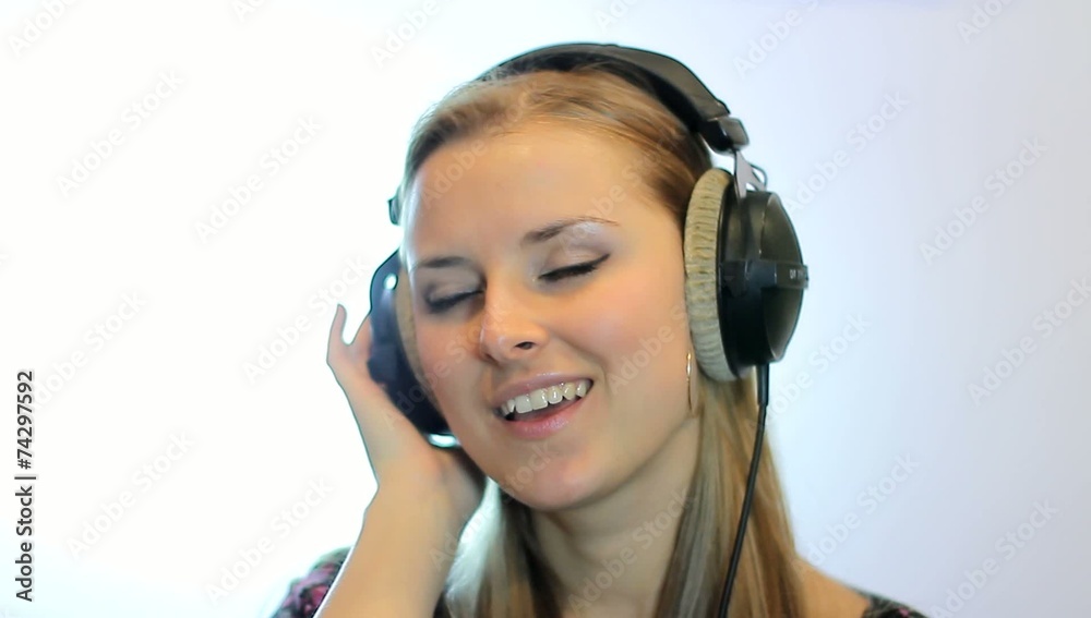 Teen girl sing at the professional audio studio. Portrait view Teen girl sing at the professional audio studio. Portrait view