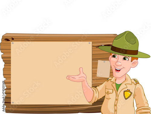 Ranger pointing at a wooden sign