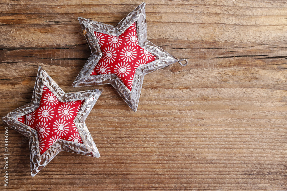 Beautiful red and silver stars on wooden background Beautiful red and silver stars on wooden background