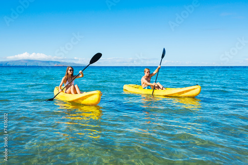 Photography Man and Woman Kayaking in the Ocean