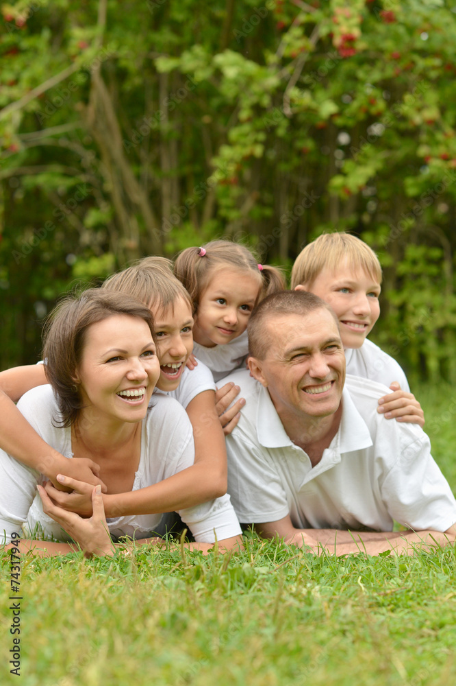 Family of five drinking tea