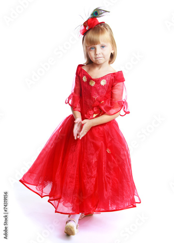 Little girl in a red ball gown.
