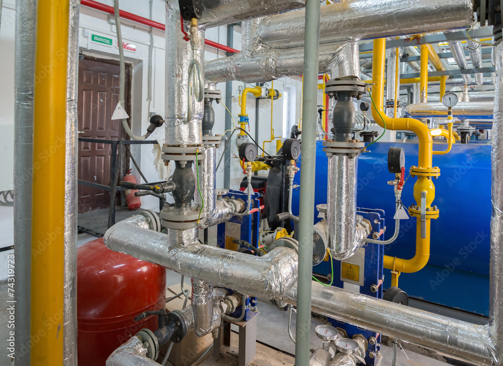 Place in a large industrial boiler room.