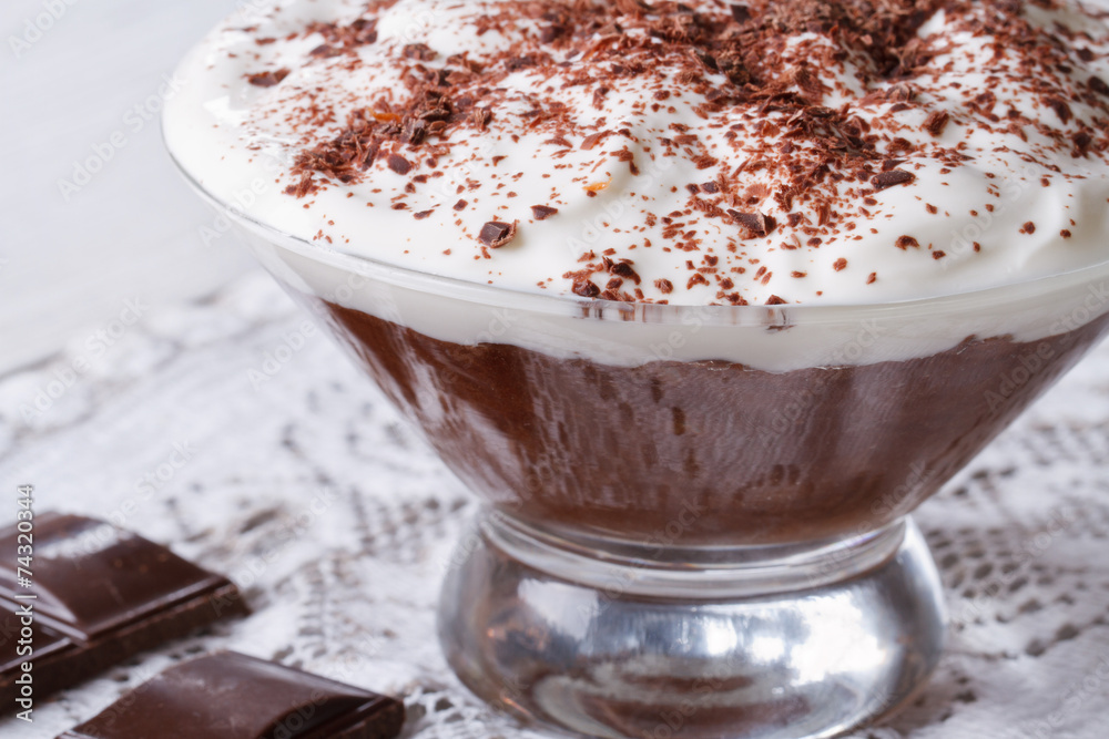 chocolate dessert with whipped cream close-up. Horizontal